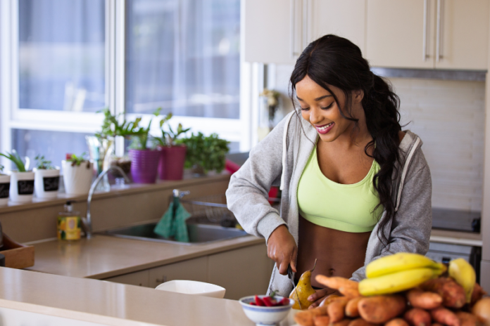 A girl is busy in kitchen for healthy food