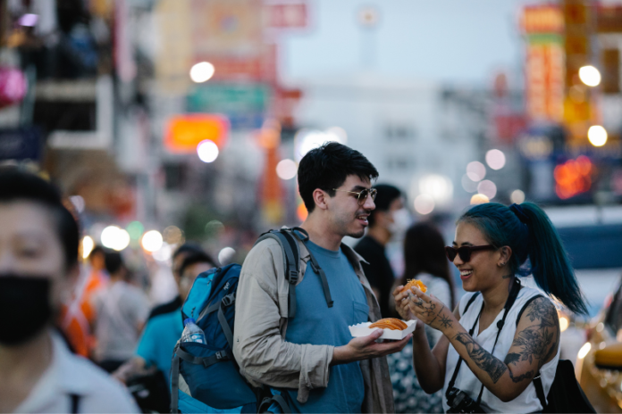 A couple travel and eating famous food