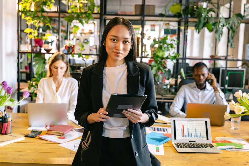 A girl is wearing printed blazer as fashion trends for femal office wear