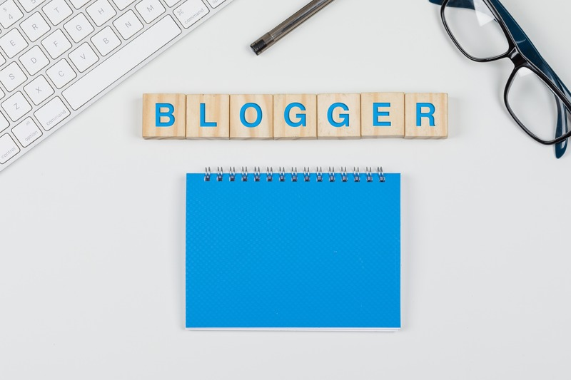 Blogger is written and diary place on table