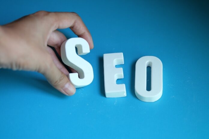 A person is placing seo blocks